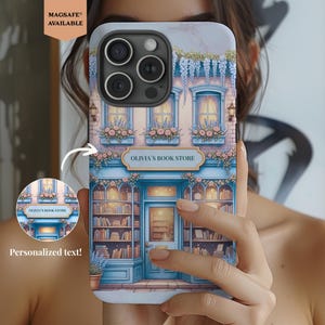 May include: A phone case featuring a detailed illustration of a bookstore facade. The design includes a blue storefront with the text "OLIVIA'S BOOK STORE", flower boxes, and hanging vines. The case is MagSafe compatible and allows for personalized text.