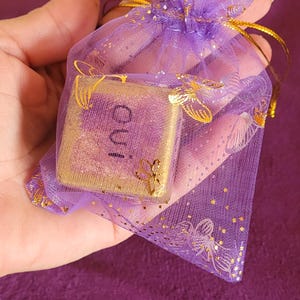 Handmade divination dice. Cast in plaster, sanded, and decorated with rice paper. The sides are handwritten/divination/fortune telling
