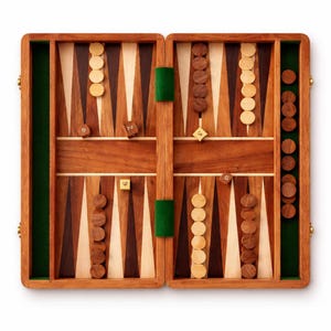 May include: Open backgammon board made of wood, featuring a rich brown finish with contrasting light wood and green felt accents. The game pieces are light and dark wooden discs, with dice showing numbers. A classic board game.