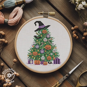 May include: A cross-stitch embroidery of a Halloween-themed Christmas tree, adorned with jack-o'-lanterns, ornaments, and a witch's hat. The design is set in a wooden embroidery hoop, with spools of thread and scissors in the background.