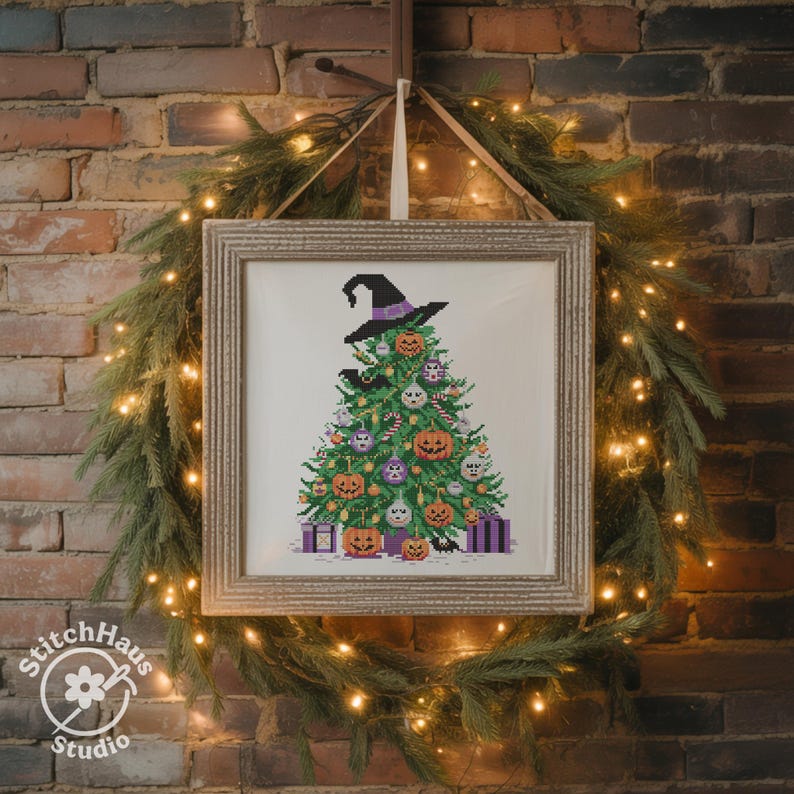 May include: A framed cross-stitch design of a Halloween-themed Christmas tree, adorned with witch hats, jack-o'-lanterns, and purple ornaments. The artwork is displayed against a brick wall, surrounded by a green garland and fairy lights.