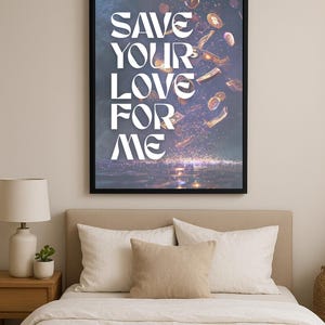 May include: A framed art print with the text "SAVE YOUR LOVE FOR ME" in white, stylized lettering. The artwork features falling coins and currency against a dark background. The print is displayed above a bed with white bedding and pillows.