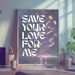 May include: Framed art print with the text "SAVE YOUR LOVE FOR ME" in white, stylized lettering. The artwork features a dark background with falling coins and currency, suggesting themes of finance and affection. The print is displayed on a wooden desk.