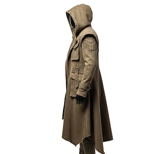 May include: A long, olive-green hooded coat with a unique asymmetrical hemline. The coat features multiple pockets, shoulder detailing, and a fitted silhouette. The model is wearing black gloves. The coat is made of a textured fabric.