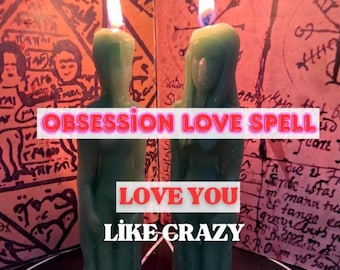 May include: Two green human-shaped candles with lit wicks stand before a background featuring handwritten text and symbols. The image includes the text OBSESSION LOVE SPELL, LOVE YOU, and LIKE CRAZY in bold, clear lettering.