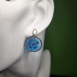 Butterfly relief stainless steel resin earrings