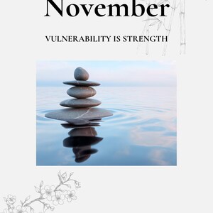 Puede incluir: Imagen serena con una pila de piedras grises lisas equilibradas en el agua, reflejando el cielo. La palabra "Noviembre" está en la parte superior, con "VULNERABILIDAD ES FUERZA" debajo. Ilustraciones de bambú y flores enmarcan la imagen.