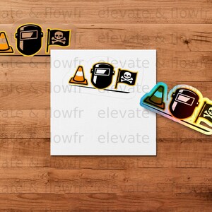 Stickers feature a welding mask and skull with crossbones, with "elevate & flowfr" text.