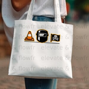 White tote bag with construction helmet, traffic cone, and skull and crossbones graphic.