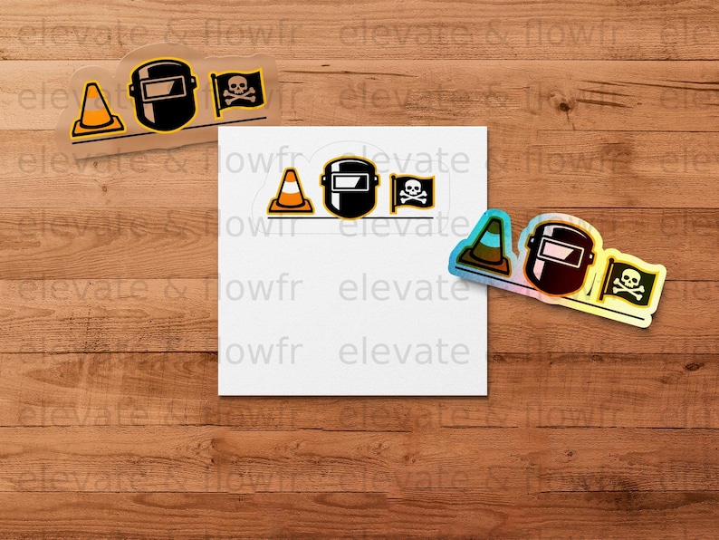 Construction helmet, skull and crossbones stickers on a wooden background.