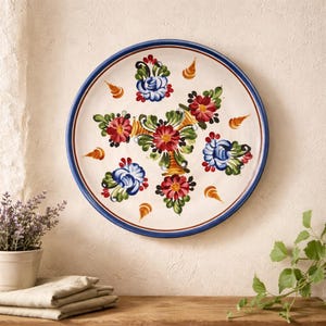 May include: A white ceramic mug with a black handle and the text "But First, Coffee" in a handwritten style. The mug is on a white surface. The mug is approximately 4 inches tall.