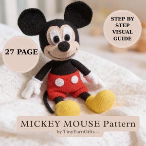 May include: A crocheted Mickey Mouse doll with black ears, a black body, red shorts, yellow shoes, and white gloves. The image includes text that reads "Mickey Mouse Pattern" and "Step by Step Visual Guide". The pattern is 27 pages long.