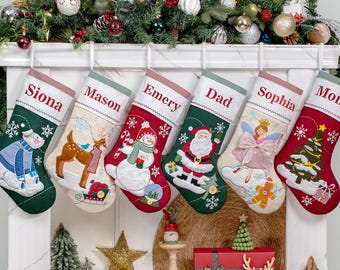 May include: Six personalized Christmas stockings hanging in a row, each featuring a unique embroidered character including a polar bear, deer, snowman, Santa Claus, fairy, and Christmas tree, with names Siona, Mason, Emery, Dad, Sophia, and Mom.