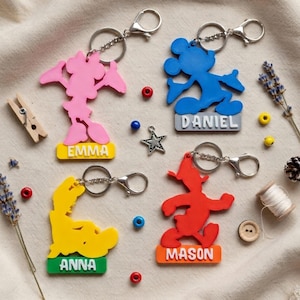 May include: A set of three ceramic mugs with a speckled, matte finish. The mugs are in shades of cream, light gray, and dark gray. Each mug has a simple, modern design and a rounded handle.