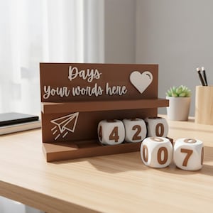 May include: A brown wooden desk calendar with the words "Days your words here" and a heart shape. The calendar has white dice with brown numbers, displaying "420" and "007". A paper airplane graphic is also present.