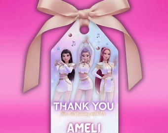 May include: A gift tag with a pink ribbon and bow. The tag features three animated figures in white outfits. Text on the tag reads "THANK YOU For Celebrating with Us AMELI". The background is a gradient of light blue, purple, and pink.