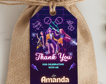 May include: A purple gift tag featuring a neon graphic of three women and musical notes. The tag says "Thank You" and "For Celebrating With Me" with the name "Amanda" at the bottom. The tag is attached to a hessian gift bag.