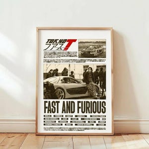 May include: A framed poster featuring the movie title "Fast and Furious" with the Japanese title "Tokyo Drift". The poster has images of cars and actors. The names of the actors are listed at the bottom of the poster.