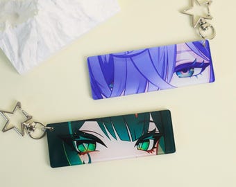 Genshin Impact Nefer eye-strip keychain, featuring vibrant acrylic eyes and a sturdy metal ring for durable keychain or bag accessory use