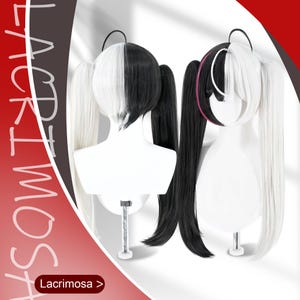 May include: A split-color wig featuring long, straight black and white hair styled into two high pigtails. The wig is displayed on two white mannequin heads, showing both the back and front views. The text Lacrimosa is visible on the image.