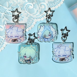 May include: Four anime-style acrylic keychains with star-shaped clasps. Each keychain features a different character design with pastel color schemes, including pink, blue, and green. The characters have large eyes and detailed outfits.