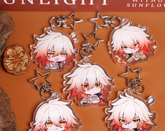 May include: Several clear acrylic keychains featuring a cartoon character with white and red hair, orange eyes, and a red outfit. Each keychain has a silver star-shaped charm and a silver keyring. The background is a warm brown color.