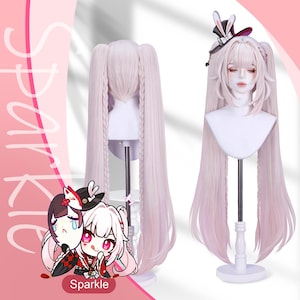 May include: A light pink cosplay wig with long, flowing hair styled in pigtails. The wig is displayed on a mannequin head, showcasing its length and style. A small black hat with bunny ears is on the mannequin head. The word "Sparkle" is in the image.