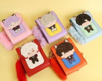 May include: Five colorful crossbody bags with cartoon character designs. Each bag features a different color: pink, purple, light blue, red, and orange. They have a cat ear design and a fluffy tail keychain. The bags have a rectangular shape.