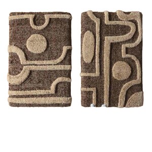 May include: Two rectangular, textured wall hangings with abstract designs. The hangings feature a brown background with beige, raised geometric shapes, including circles and curved lines. The overall aesthetic is modern and artistic.