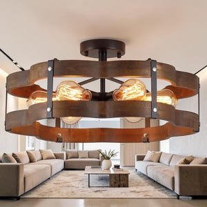 May include: A white ceramic mug with a black handle and the text "But First, Coffee" in a bold, black font. The mug is set against a blurred background, highlighting its clean design.