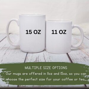 May include: Two white ceramic mugs, one labeled "15 OZ" and the other "11 OZ". The mugs are displayed on a light wood surface. Text at the bottom reads "MULTIPLE SIZE OPTIONS" and "Our mugs are offered in 11oz and 15oz, so you can choose the perfect size for your coffee or tea."