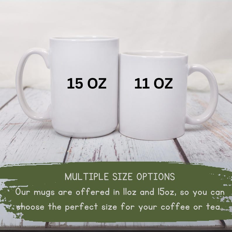 May include: Two white ceramic mugs, one labeled "15 OZ" and the other "11 OZ". The mugs are displayed on a light wood surface. Text at the bottom reads "MULTIPLE SIZE OPTIONS" and "Our mugs are offered in 11oz and 15oz, so you can choose the perfect size for your coffee or tea."