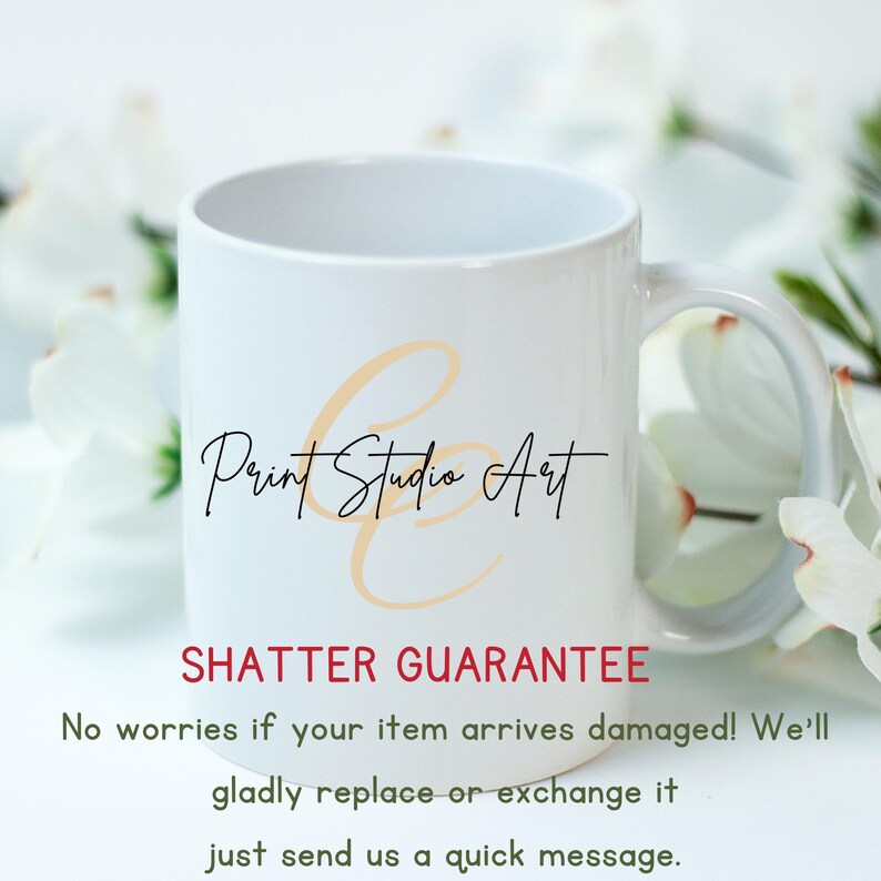 May include: White ceramic mug with the text "Print Studio Art" in black script. The mug also has the text "SHATTER GUARANTEE" in red. The mug is surrounded by white flowers.