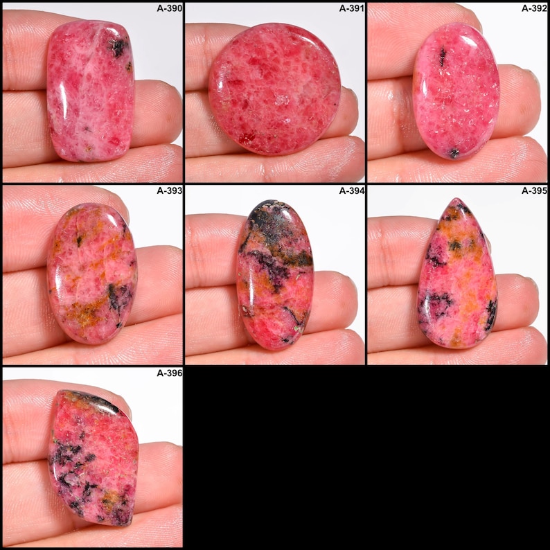 May include: A collection of polished gemstones in various shapes, including rectangular, oval, and teardrop. The stones display a vibrant pink hue with black and orange inclusions, creating a unique pattern. Each stone is held in a hand.