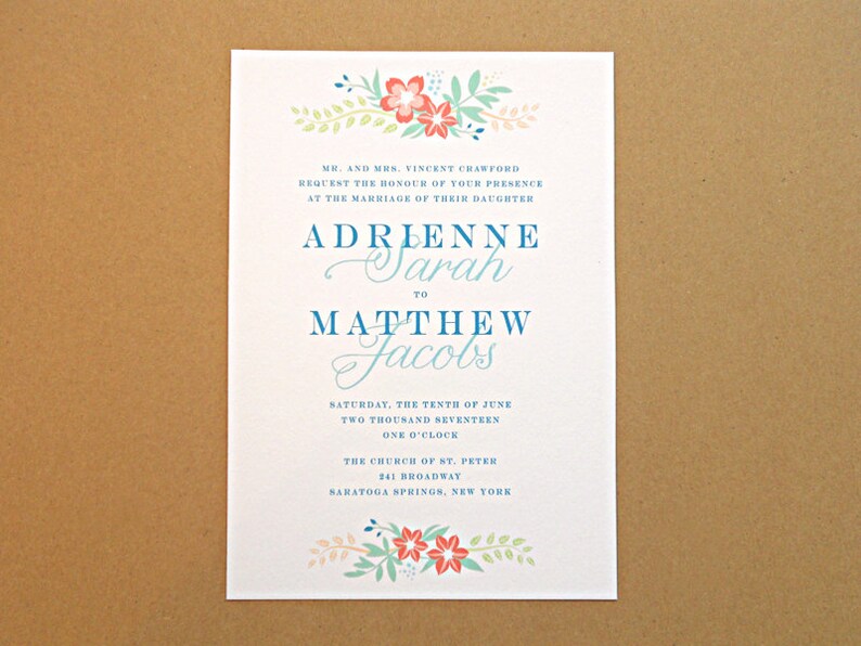 May include: A wedding invitation with a floral design in shades of pink, blue, and green. The invitation announces the marriage of Adrienne Sarah to Matthew Jacobs on Saturday, June 10th, 2017 at 1:00 PM at the Church of St. Peter in Saratoga Springs, New York.