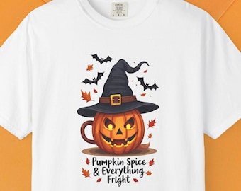 May include: White t-shirt featuring a Halloween-themed design. The graphic includes a jack-o'-lantern wearing a witch's hat, surrounded by bats and autumn leaves. The text reads "Pumpkin Spice & Everything Fright."