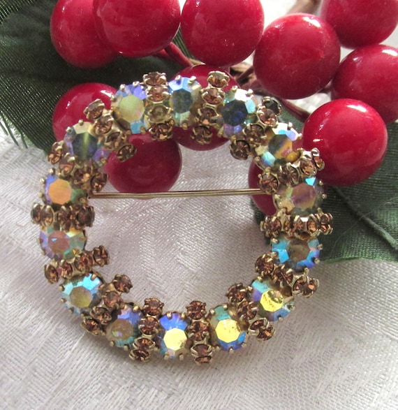 Vintage Round Brooch featuring Amber and AB prong-set stones, crafted with gold-tone metal.