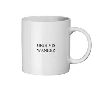 May include: White ceramic mug with a curved handle. The mug features the text "HIGH VIS WANKER" in black, centered on the front. The mug is cylindrical and appears to be empty.