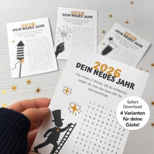 以下が含まれることがあります： ドイツ語で「2026 DEIN NEUES JAHR」と書かれた新年カードのセット。花火、シャンパングラス、煙突掃除人のイラストが描かれています。金色の星の紙吹雪が散らばっています。