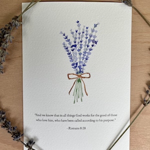 May include: Watercolor painting of a lavender bouquet tied with a brown ribbon. The artwork includes the text "And we know that in all things God works for the good of those who love him, who have been called according to his purpose." - Romans 8:28.