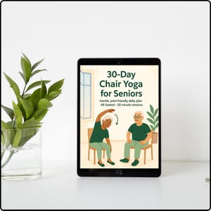 May include: A digital tablet displays a colorful illustration for a 30-Day Chair Yoga program for seniors. The image shows two elderly people demonstrating yoga poses while seated. The text on the screen reads "30-Day Chair Yoga for Seniors."