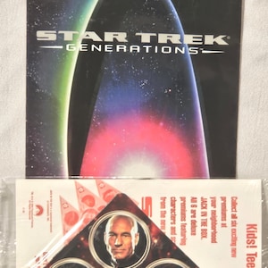 May include: A Star Trek Generations promotional item. The top portion features the movie title with a colorful nebula design. Below is a triangular premium with character portraits and the text "JACK IN THE BOX".