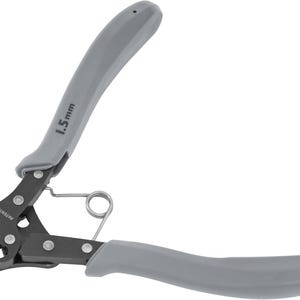 May include: A pair of gray and black wire loop pliers. The handles are gray, and the tool has a spring and the text "1.5mm" printed on the handle. The word "PATENTED" is printed on the tool.