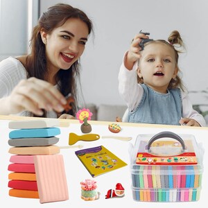 May include: A clear plastic carrying case filled with colorful modeling clay, with a variety of tools and accessories. The image also shows a stack of clay in various colors, along with a smiling woman and a young child.