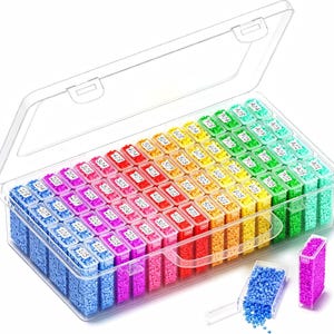 May include: A clear plastic storage container with a hinged lid, filled with numerous small, rectangular, removable compartments. Each compartment contains tiny, colorful beads arranged in a spectrum, labeled with numerical codes.