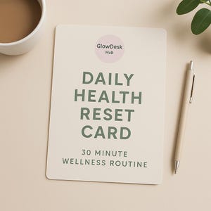May include: A cream-colored card with the text "DAILY HEALTH RESET CARD" in green, along with "30 MINUTE WELLNESS ROUTINE." A pen and a cup of coffee are also present. The card has a pink circle with the text "GlowDesk Hub."