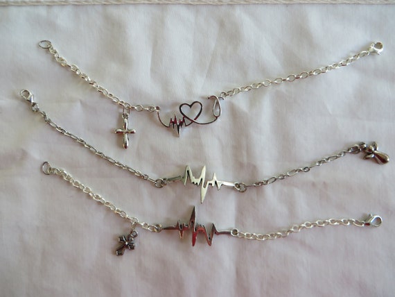 Pulseras de frecuencia cardiaca con amuleto cruzado pulsera corazon frecuencia cruz estetoscopio corazon frecuencia cardiaca angel Etsy Espana