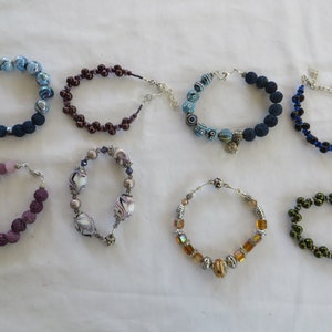 Variety of Bracelets, bracelet, lava beads, essential oil, lavender, brown, swirl, topaz
