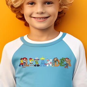 Ready to press Toy Story DTF Transfer showing Woody, Buzz, Jessie, and friends in a fun custom name design for Halloween or birthdays.