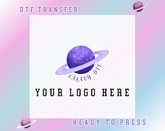 May include: A DTF transfer design featuring a purple planet with rings and the text "GALAXY DTF". The words "YOUR LOGO HERE" are displayed below the planet, with "DTF TRANSFER" and "READY TO PRESS" above and below.